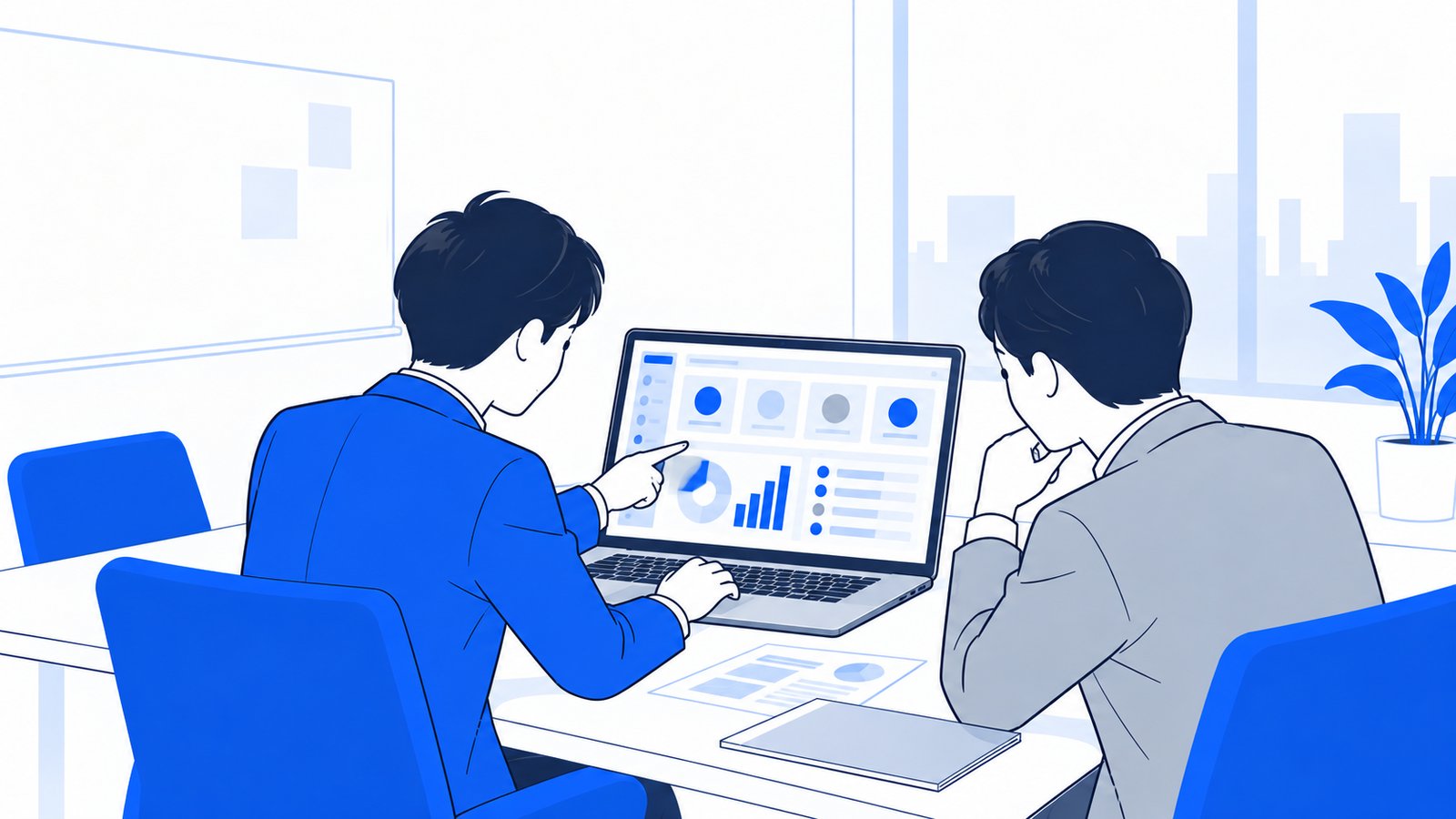 会議室で、全社のエージェントの管理画面をPCで確認する情報システム担当者と管理職