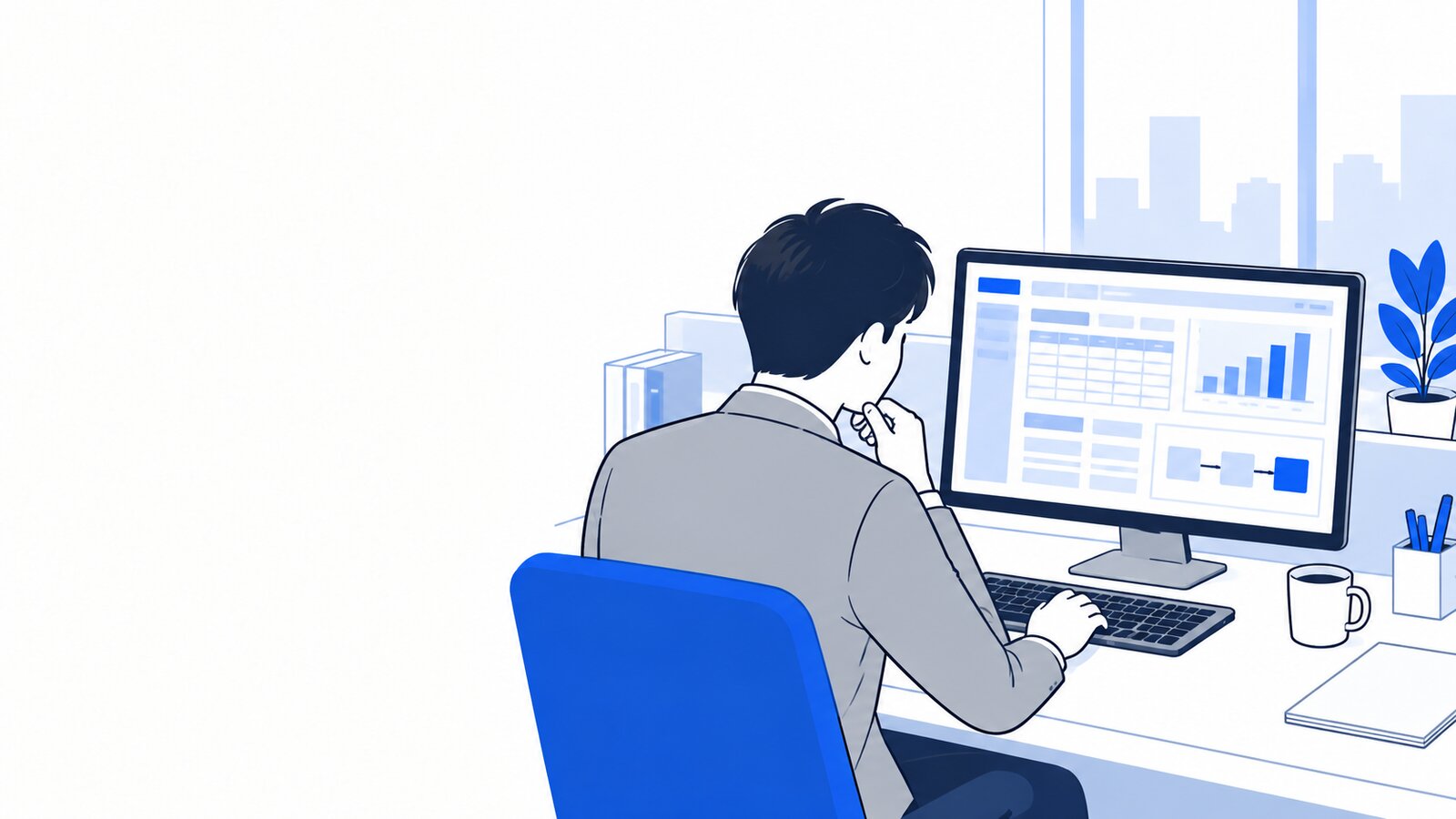 パソコンで社内の業務システムの画面を見ながら、AIの組み込みを考える担当者