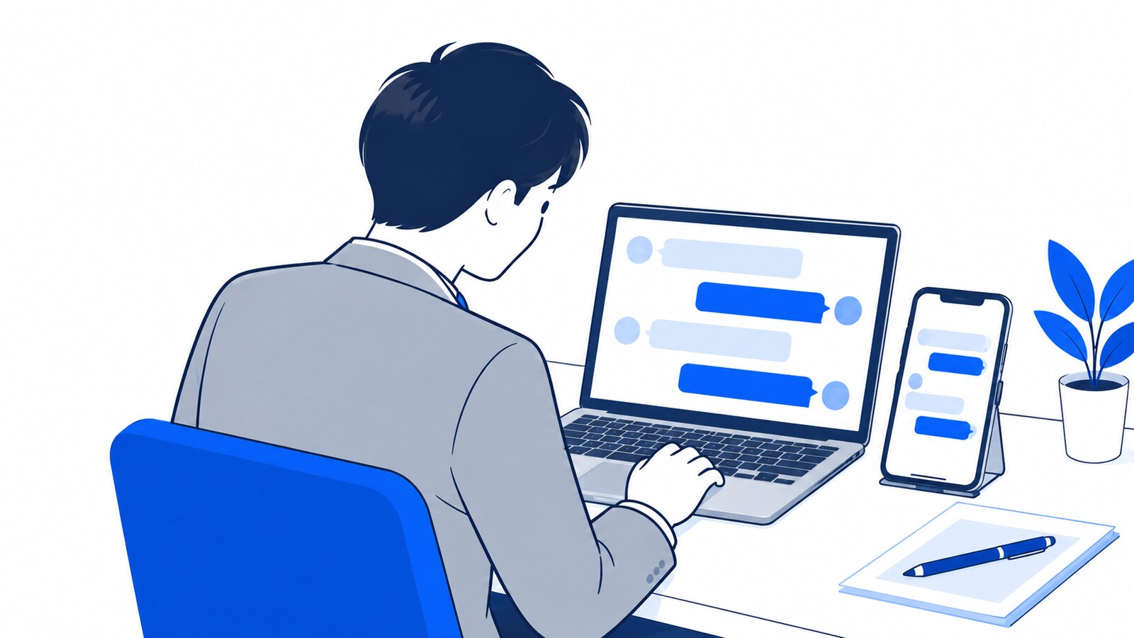デスクでノートPCとスマホを並べて、同じ会話の続きを確認している会社員