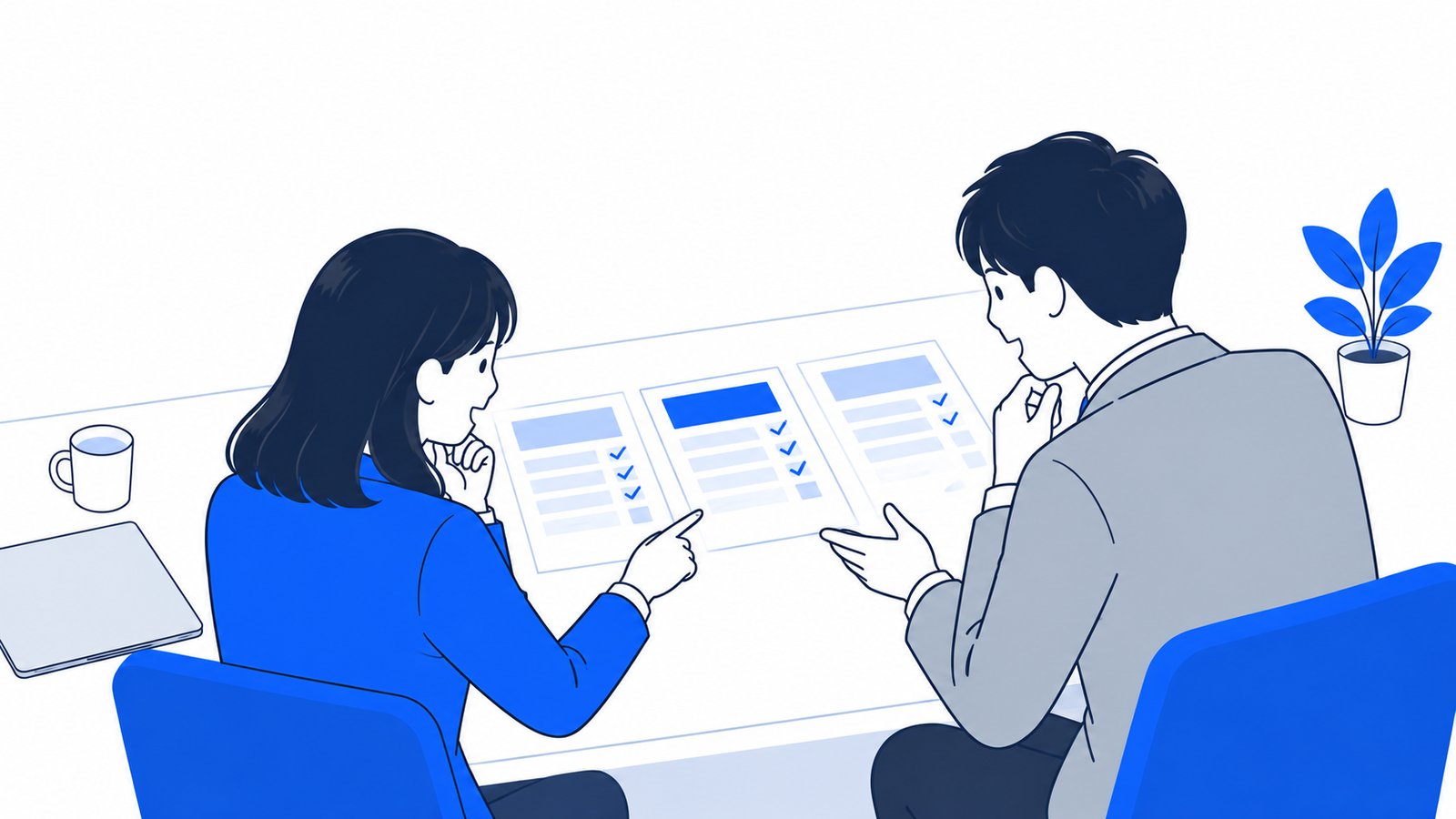 料金プランの資料を見比べて、どのプランにするか相談する2人の社員