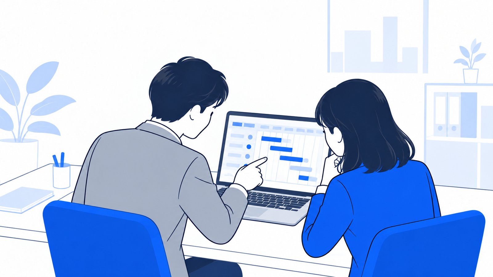 ノートPCの画面に表示された計画を、同僚と一緒に確認しながら進める会社員