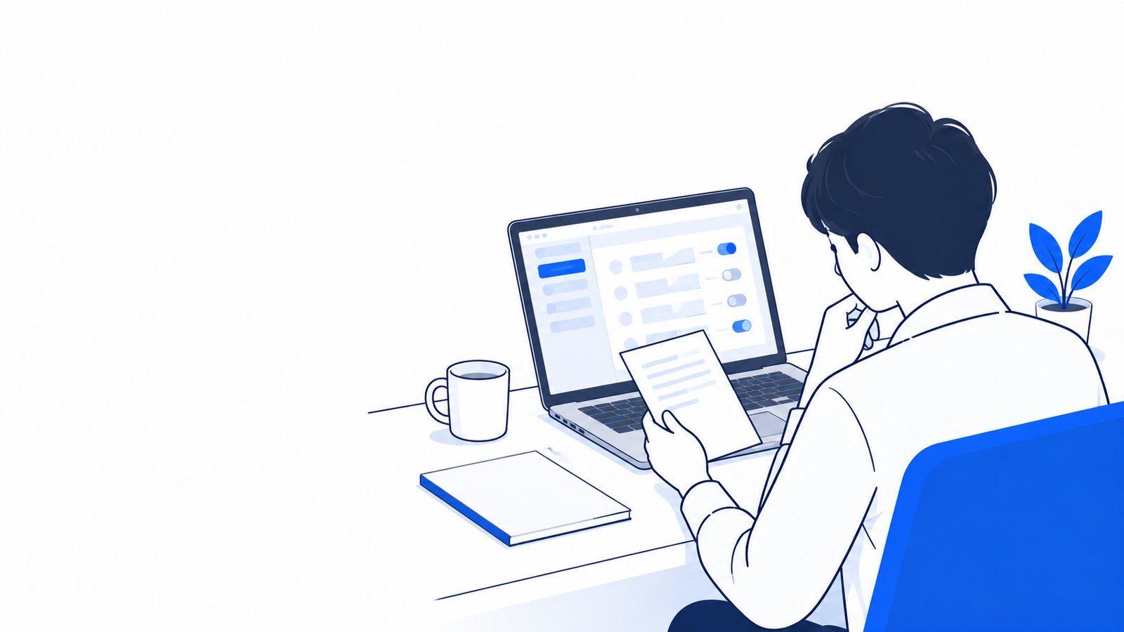 ノートPCの前で、画面とメモを見比べながら設定を考える会社員
