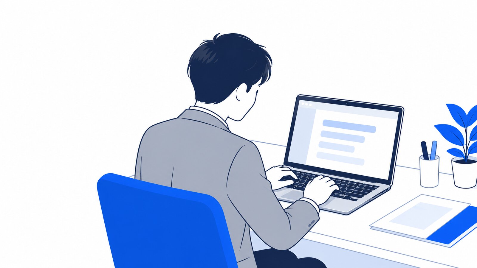 事務職の会社員がノートPCに向かい、日本語で依頼文を打ち込んでいる場面