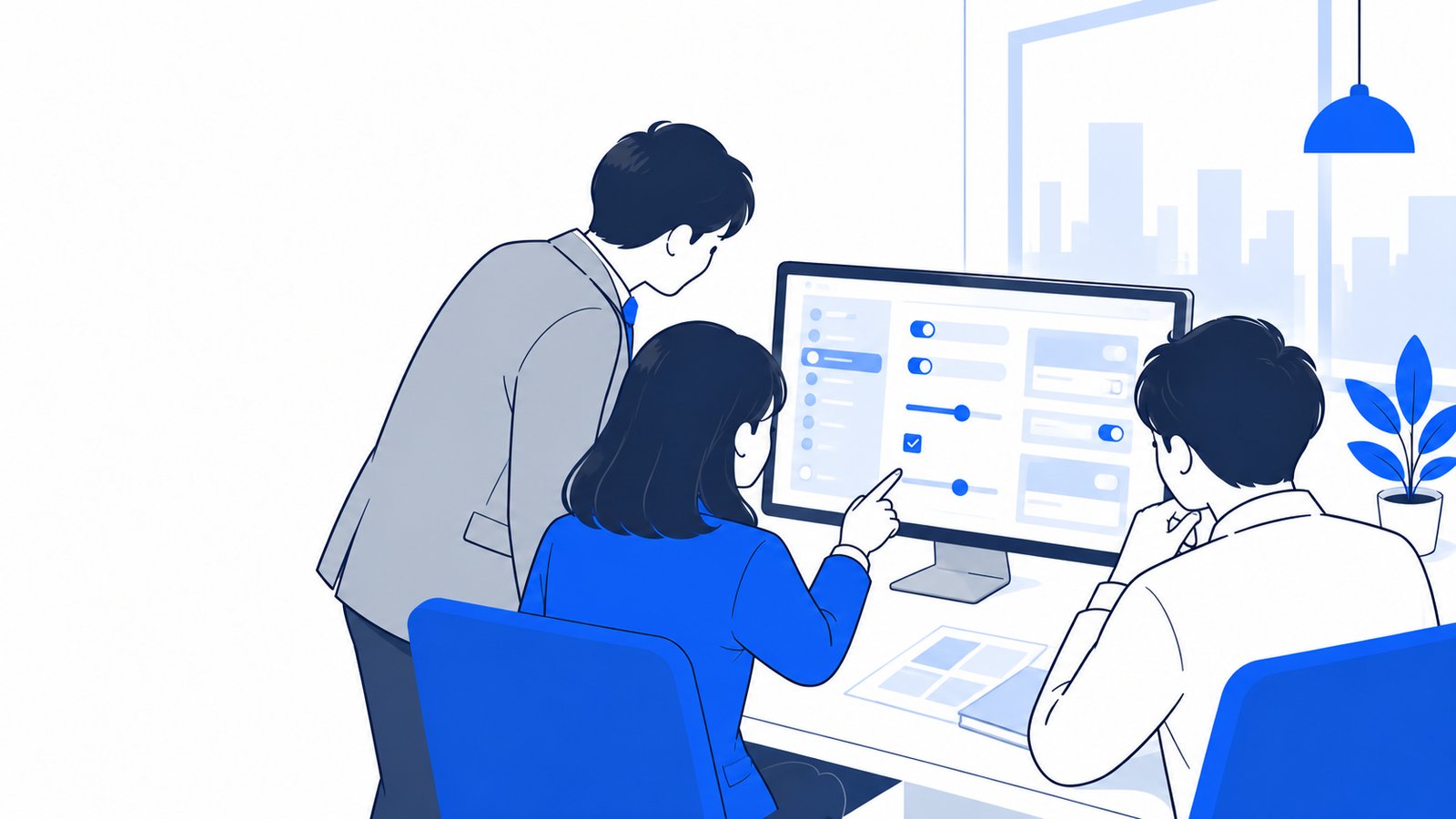 完成した設定ファイルをチームのメンバーと画面で見ながら確認している会社員