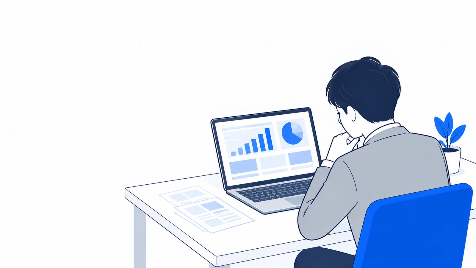 机でノートPCに表示された調査結果を読む担当者