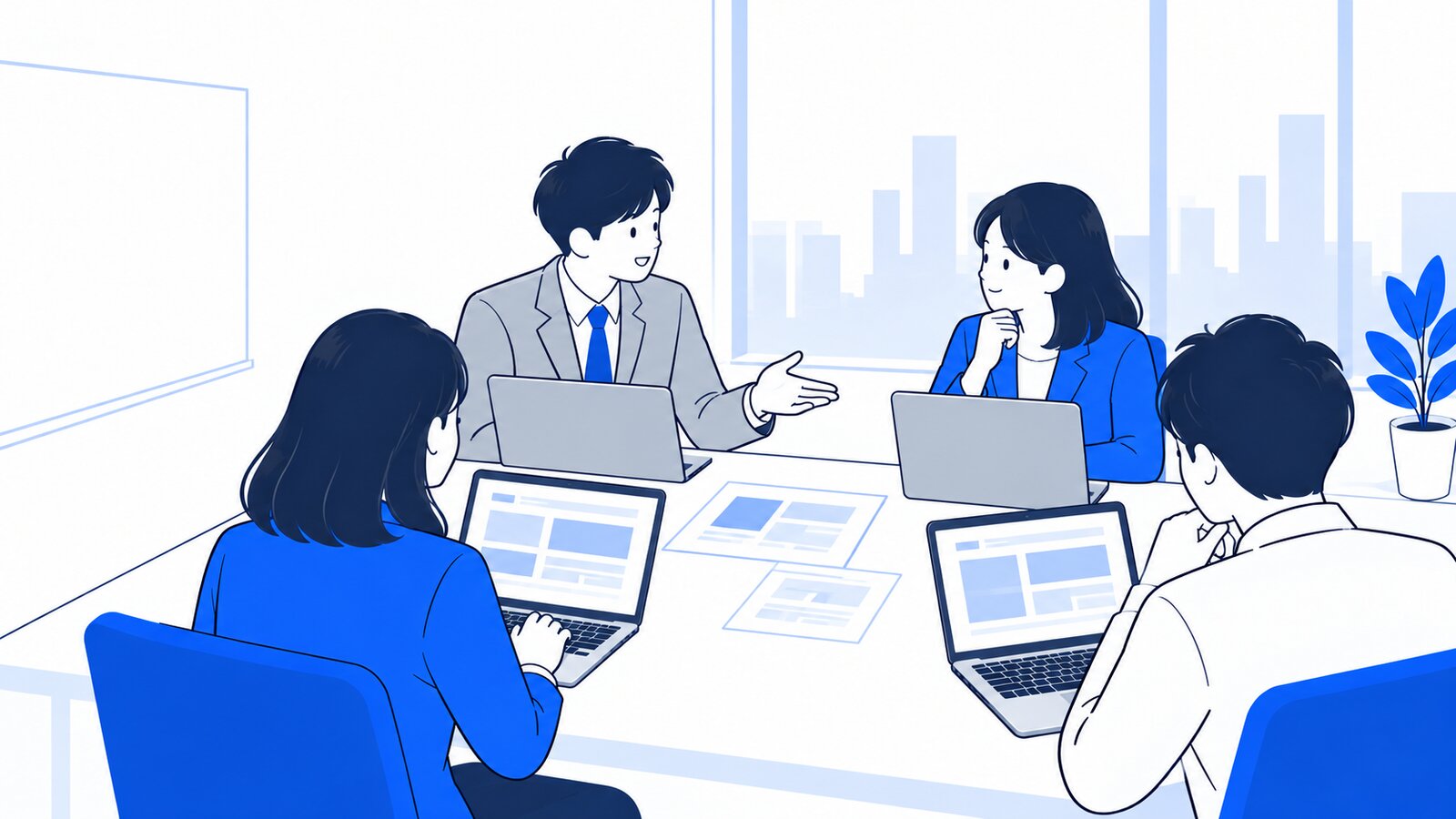 会議室で、ノートPCを開いたまま利用ルールを話し合う数人