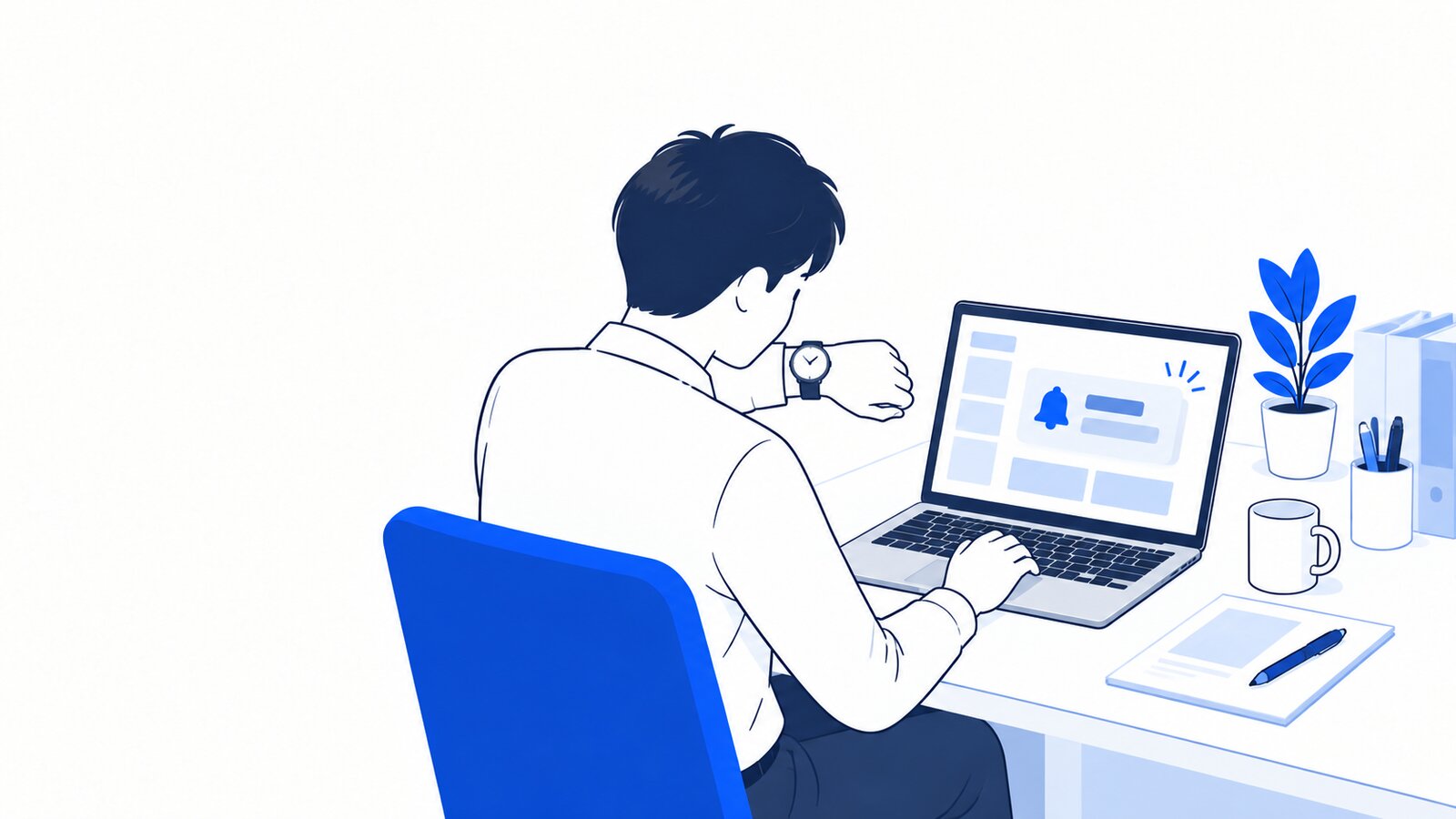 自席でノートPCに表示されたお知らせを見ながら時計を確かめる会社員