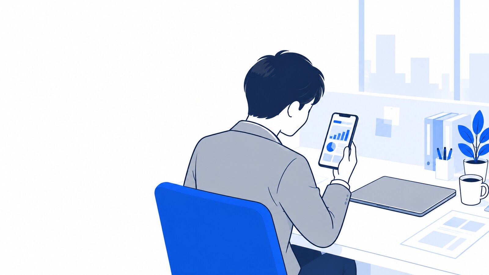 ノートPCを閉じて、スマホで作業の進み具合を確かめる会社員