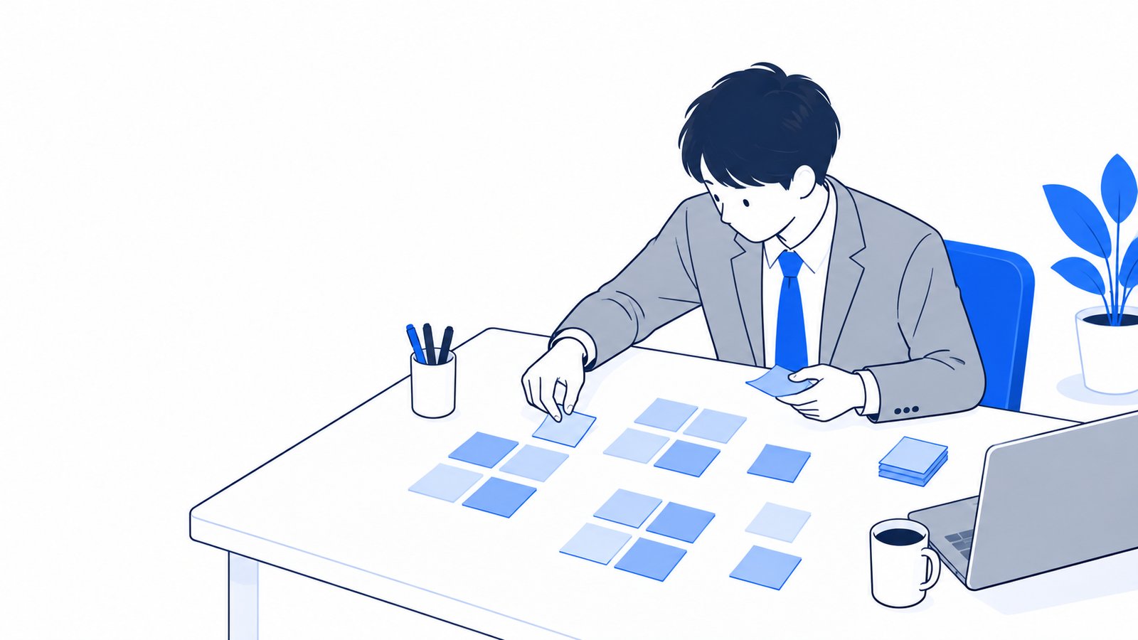 用途を書いた付箋を机の上に並べて、使う方法を整理している担当者