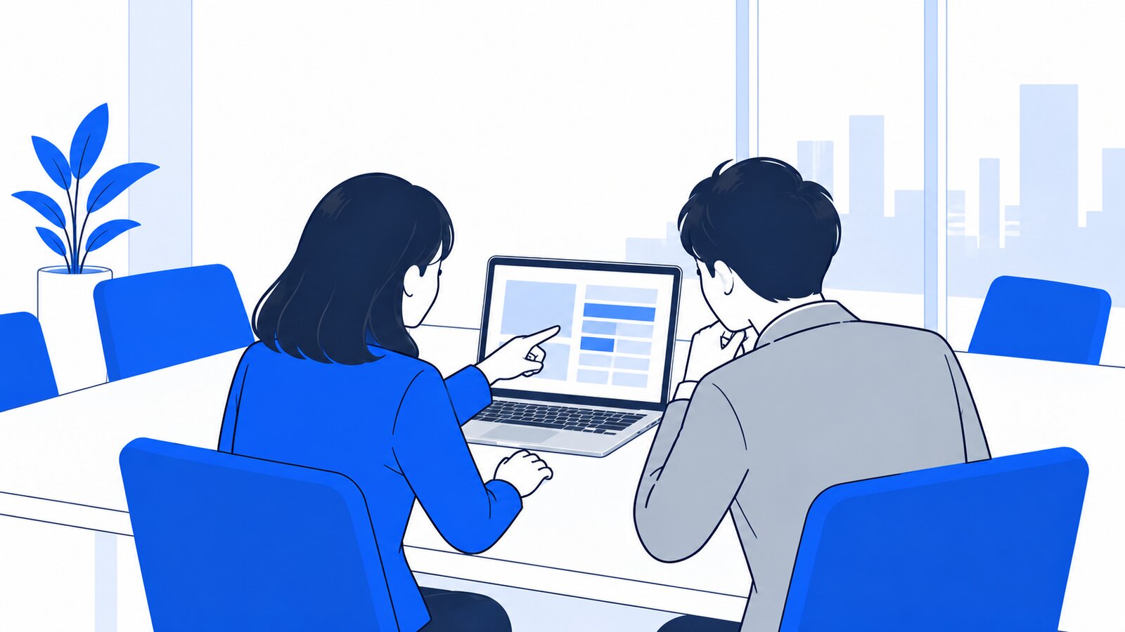 会議室でノートPCを見ながら作業のルールを話し合う二人