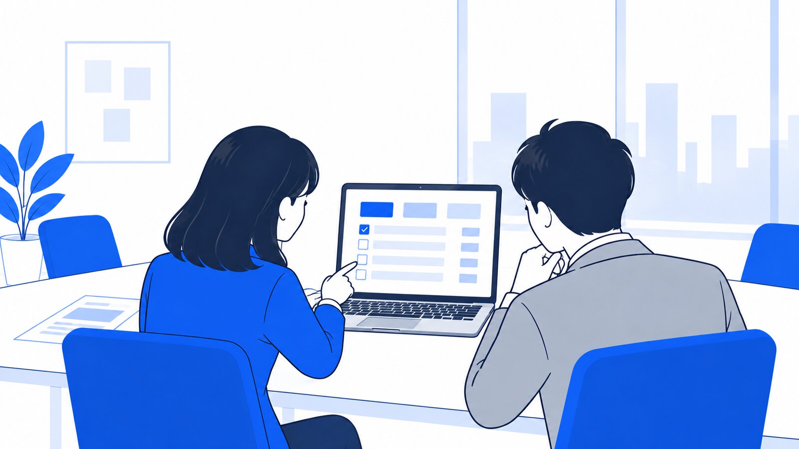 会議室で担当者がノートPCの業務一覧を上司に見せ、使うモデルを相談している場面