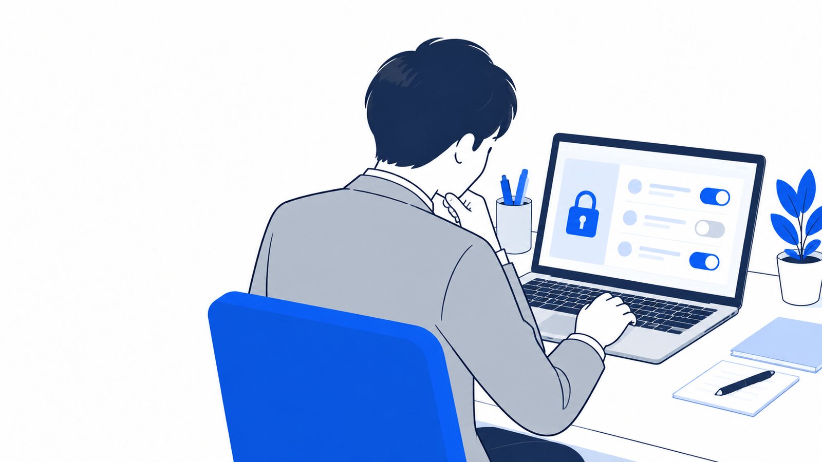 ノートPCでプライバシーの設定画面を確かめる会社員