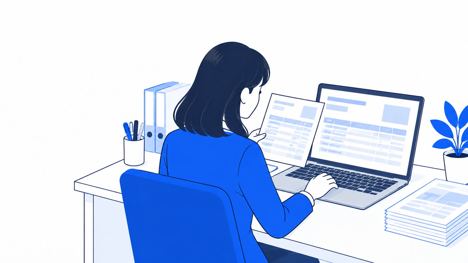 経理担当が自席でノートPCを使い、請求書を確認している様子。画面は本人の方を向いている