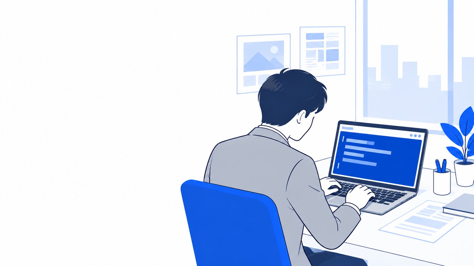 オフィスでWindowsのノートPCのPowerShellを操作する会社員