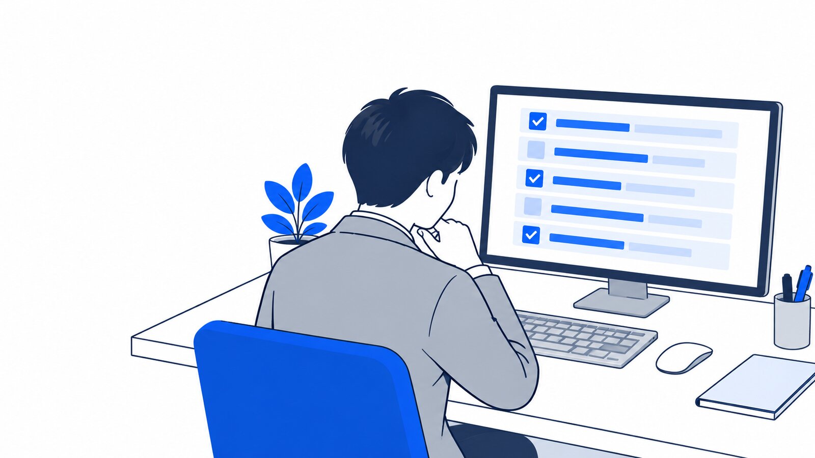 デスクで、画面に表示された変更点の一覧を確認している担当者