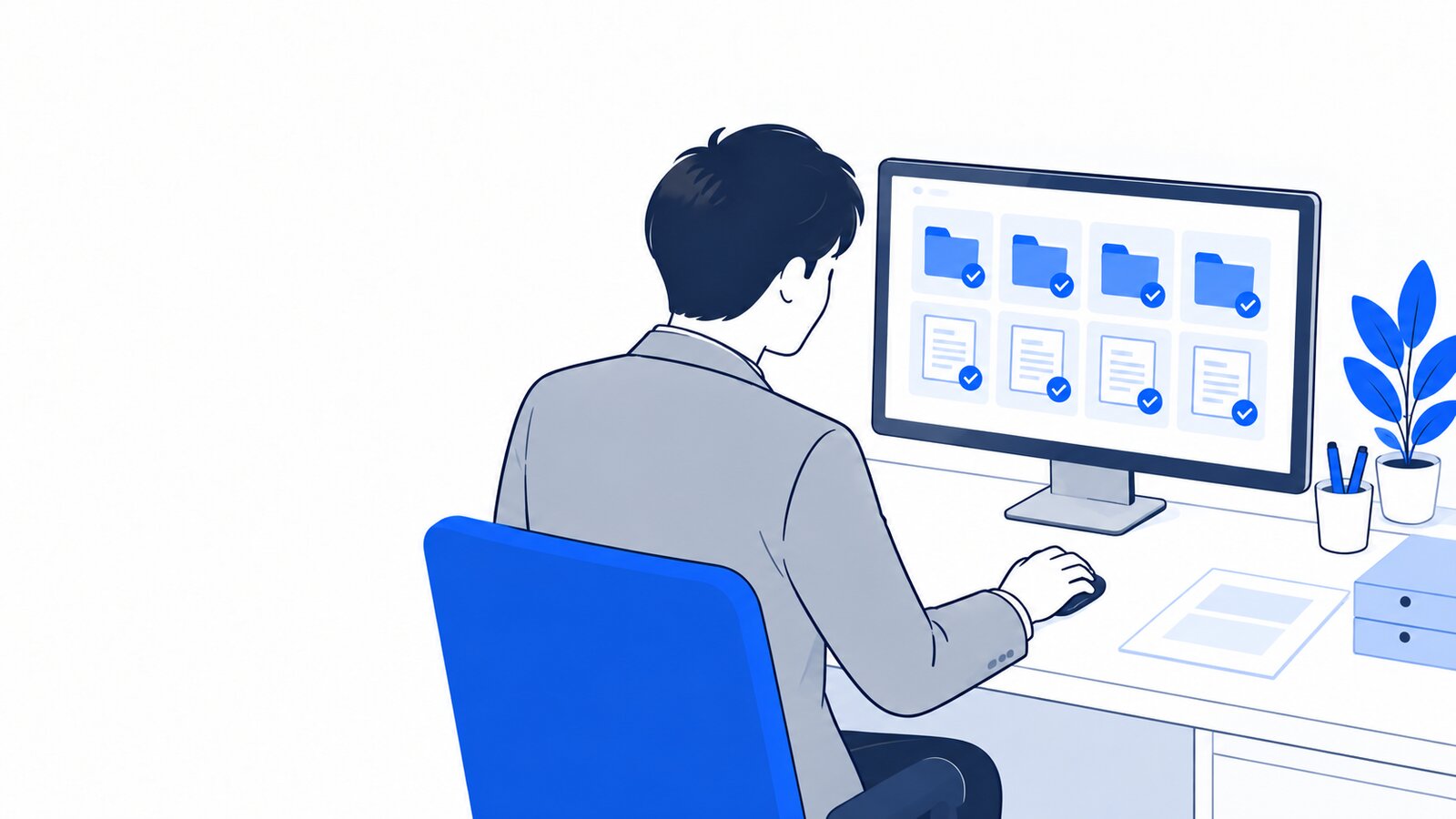 事務担当がパソコンで、整理されたファイルの結果を確認している