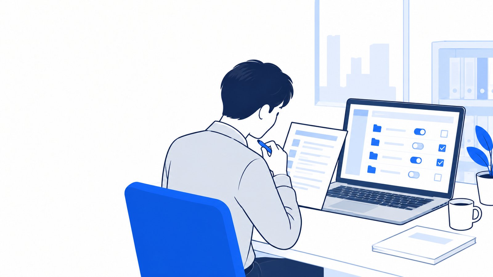 計画のメモと、権限の設定画面を見比べながら確認する会社員