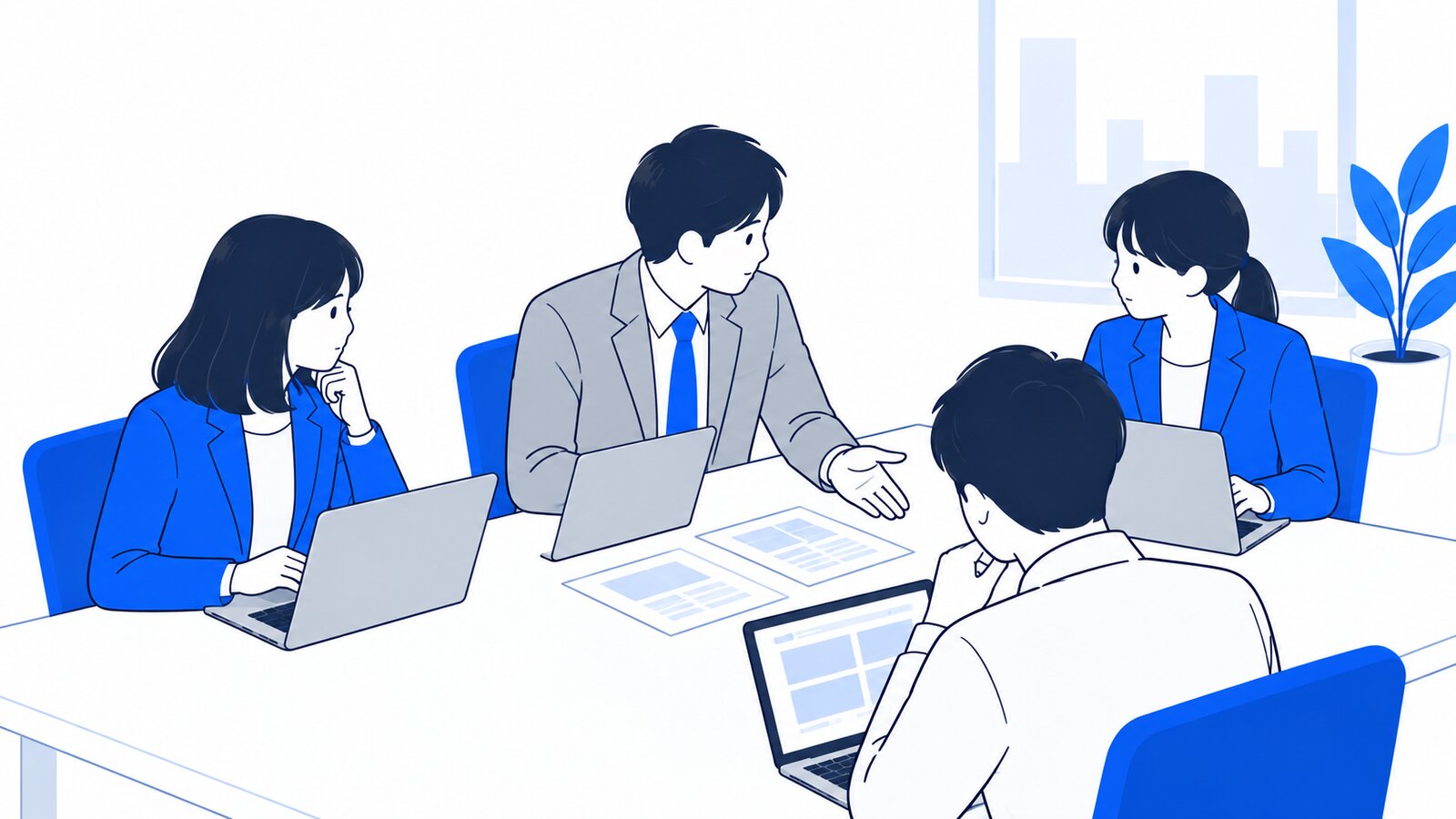 会議室で、ノートPCを開いたまま社内ルールを話し合う数人