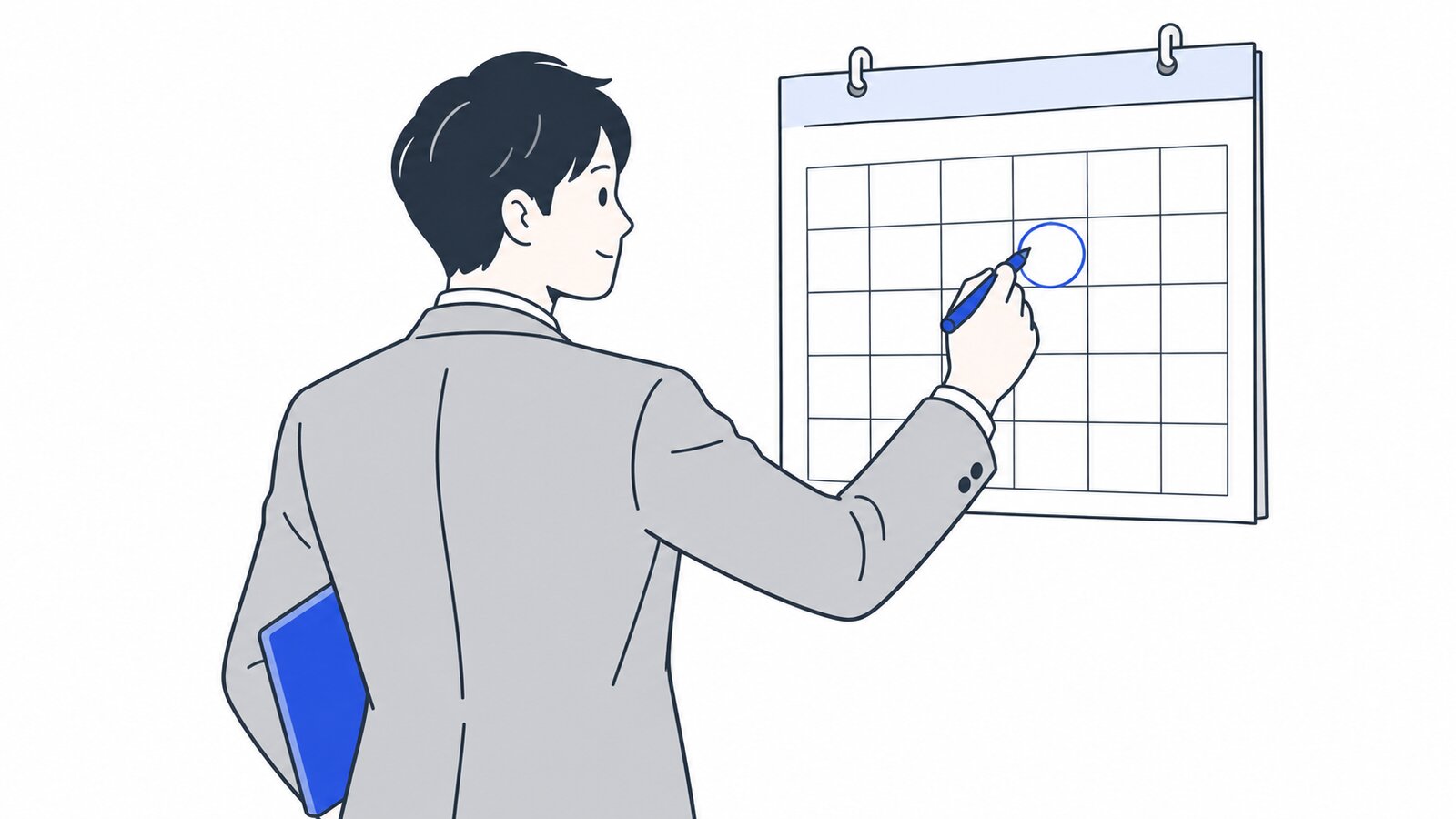 壁のカレンダーに締切日を書き込む担当者