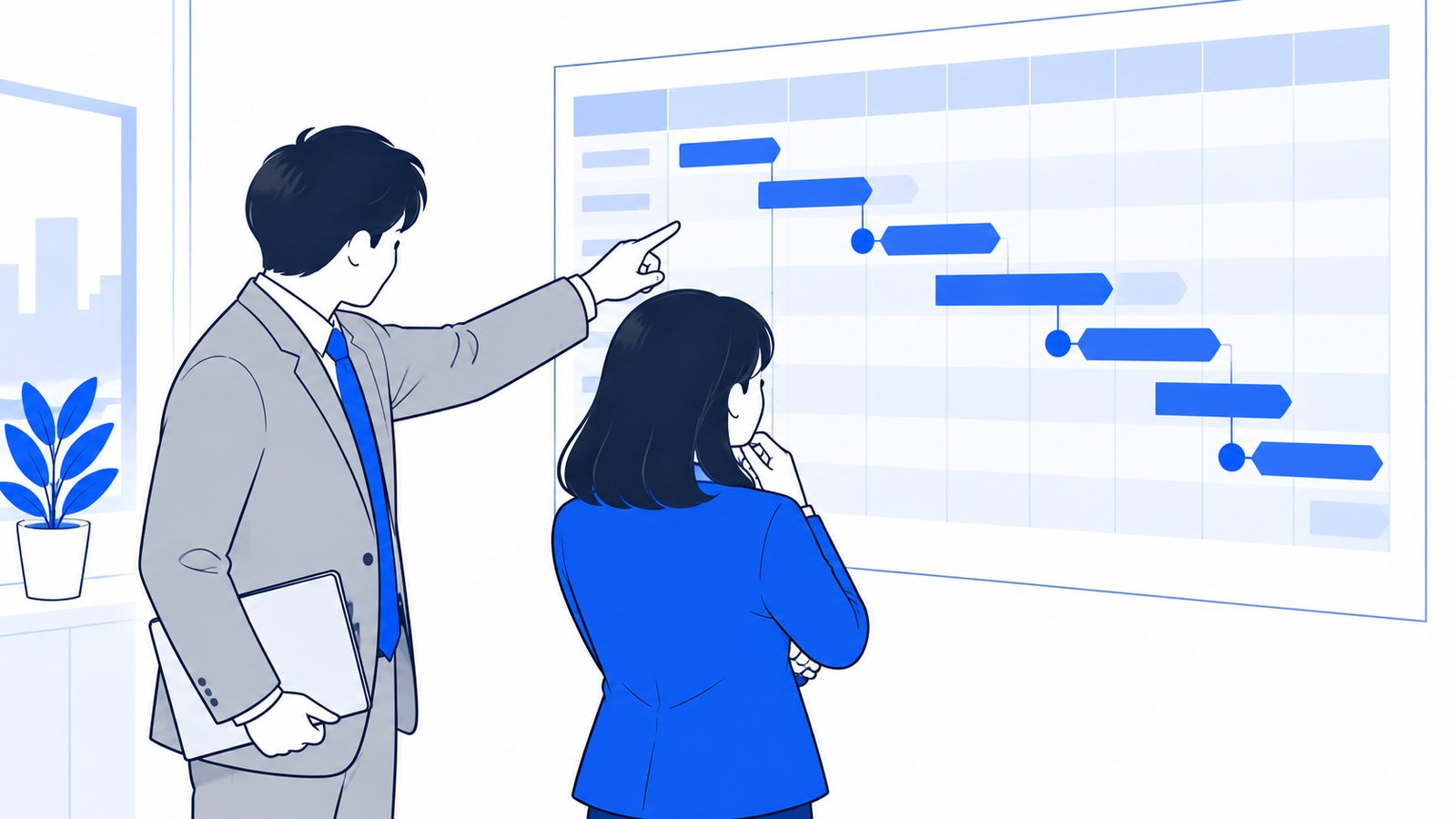 壁に貼った工程表の前で、担当者と制作会社の担当が公開までの段取りを指さしながら確認している