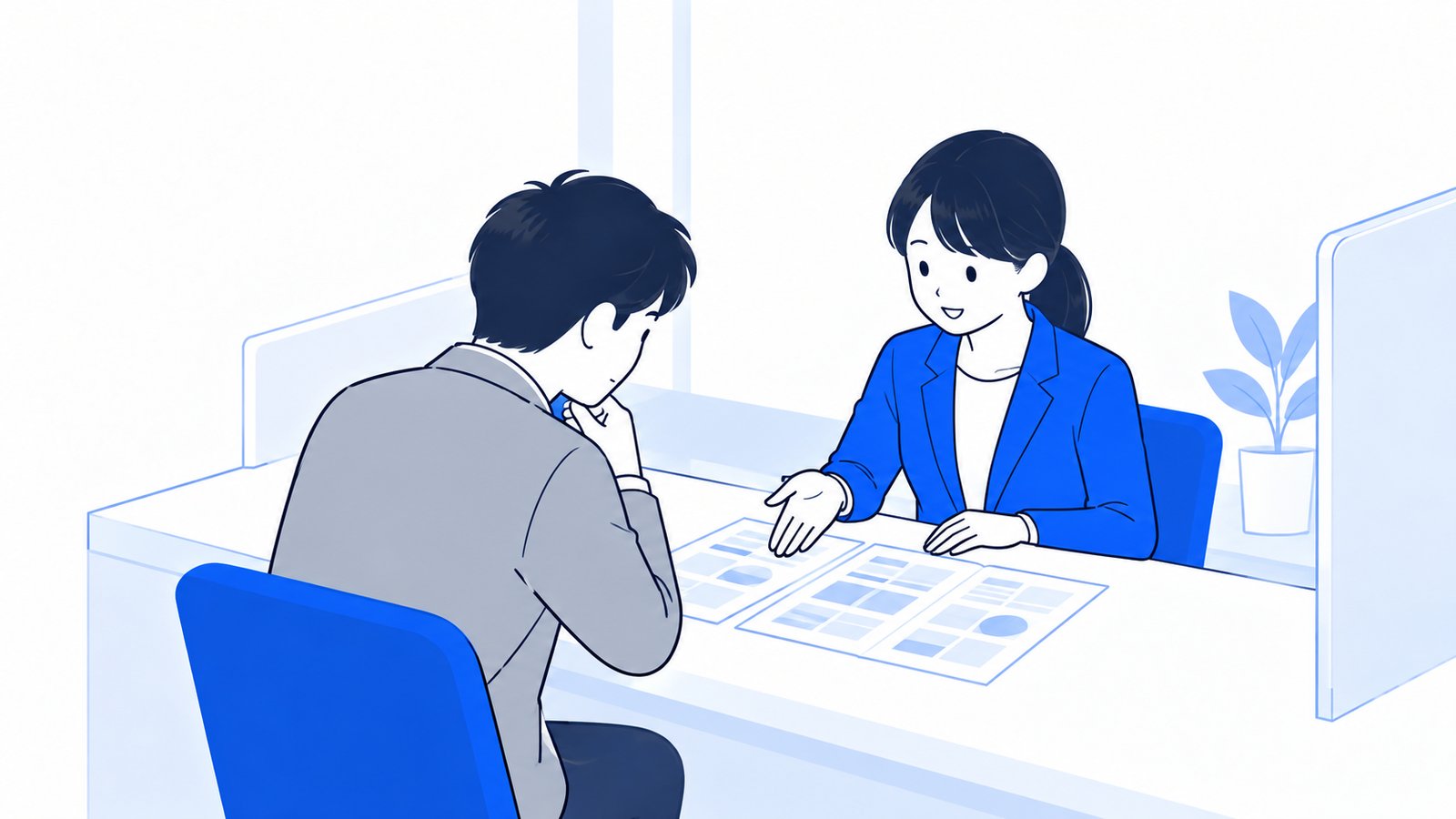 商工会議所の窓口で担当者が相談員と書類を見ながら話している様子