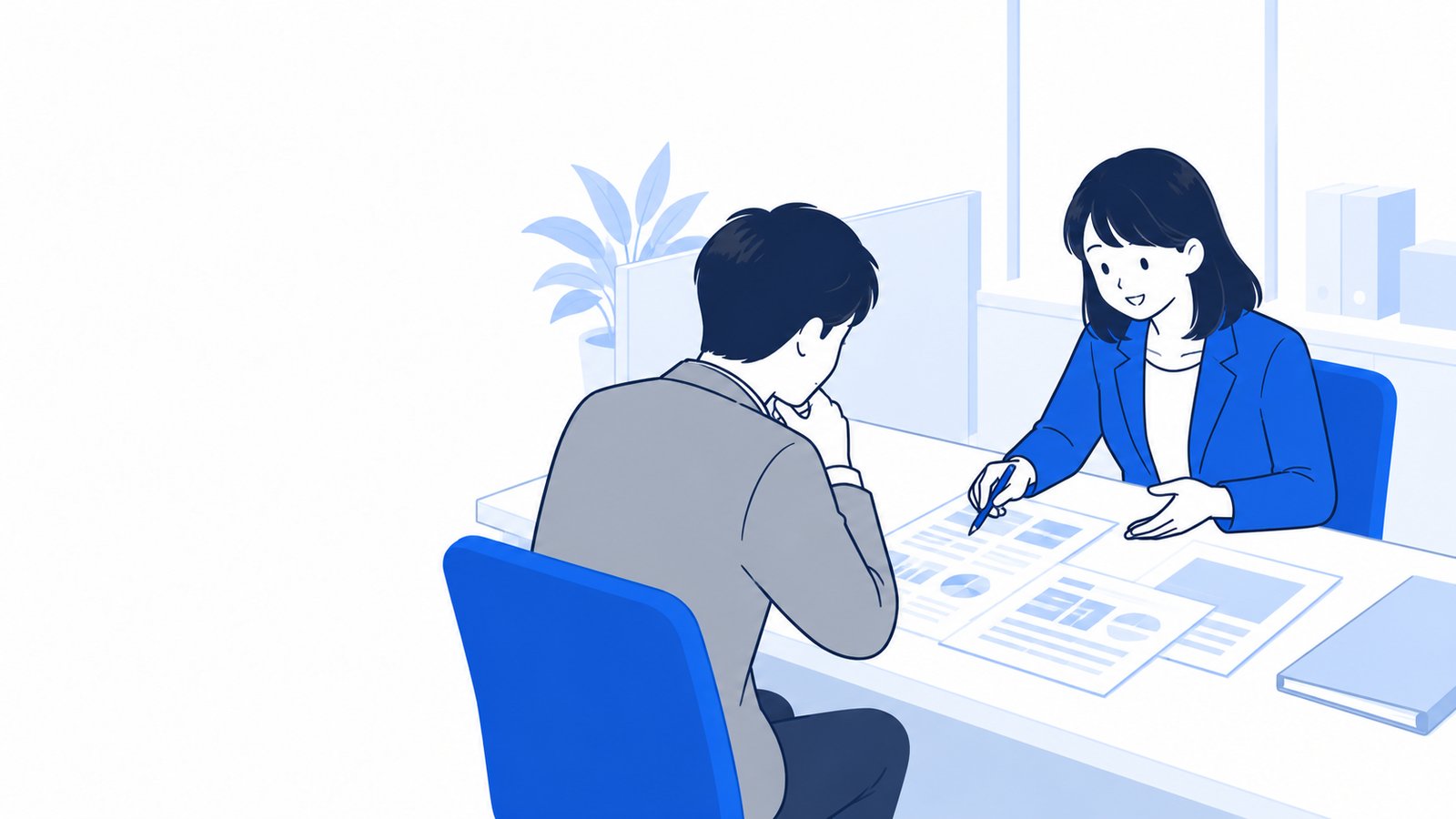 商工会の窓口で、担当者が相談員と補助金の資料を見ながら話している様子