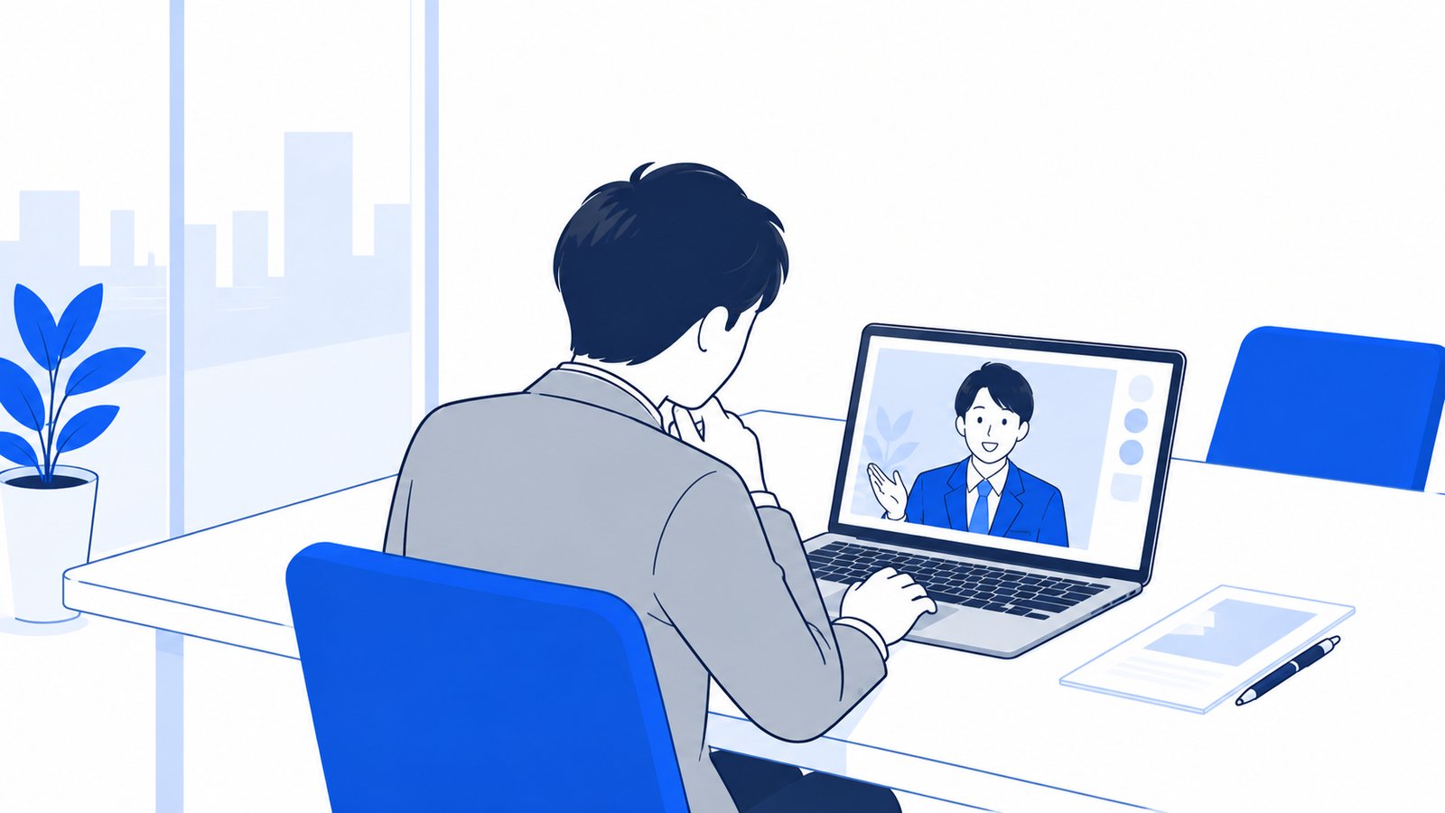 担当者が会議室でノートPCを開き、オンラインで制作会社の担当者と打ち合わせをしている場面