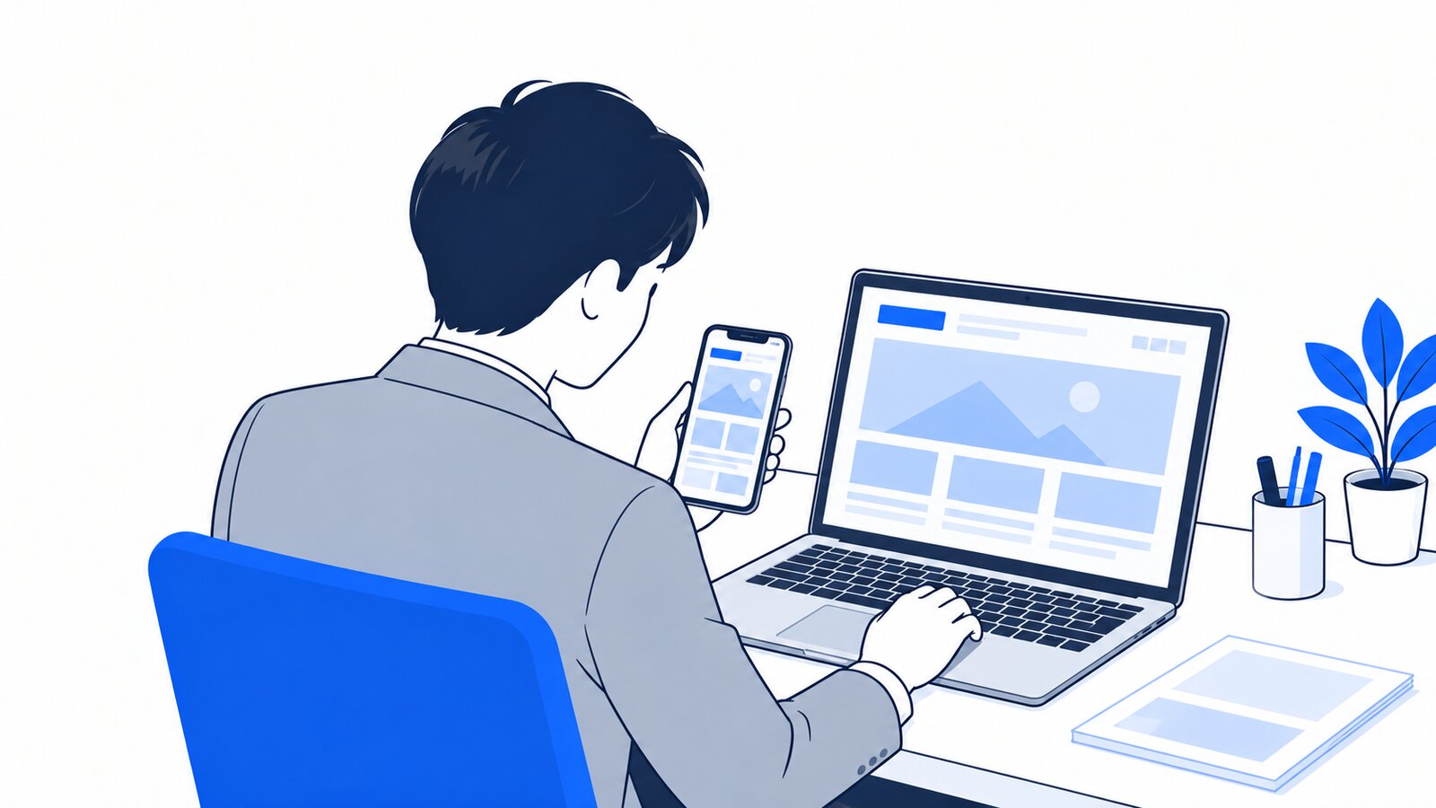 担当者がスマホとノートPCで自社のホームページの表示を見比べて確認している場面